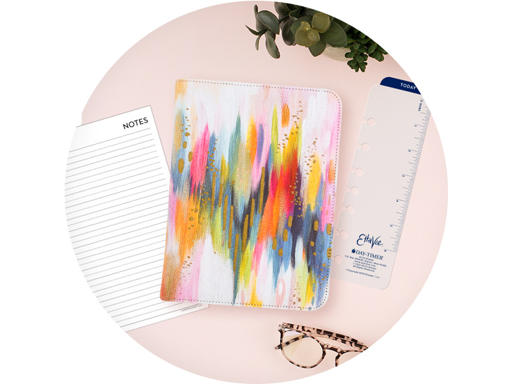 Painterly design planner cover with accessories on simple desk setting
